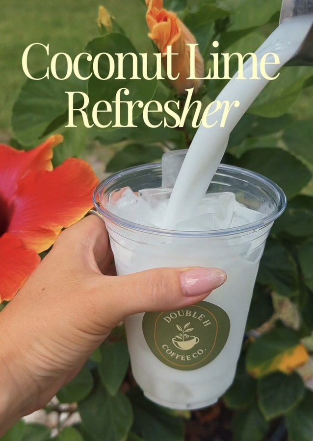 Hand holding a Double H Coffee Co. coconut lime refresher