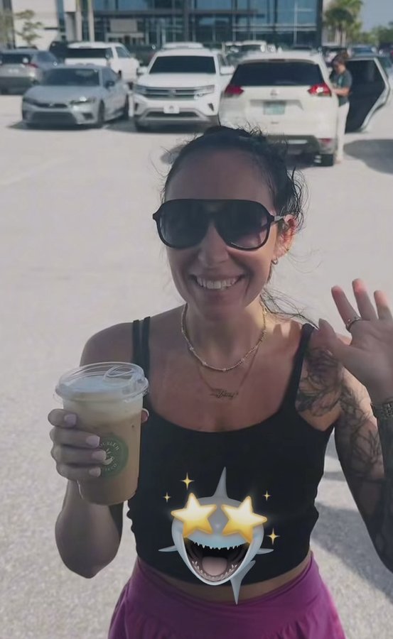 Customer holding up a Double H Coffee Co. drink
